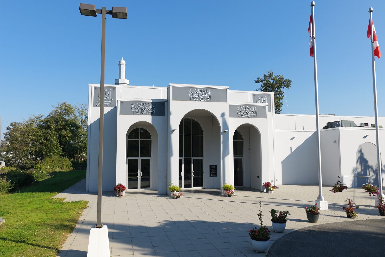 Exterior of the mosque's main entrance with arched doorways